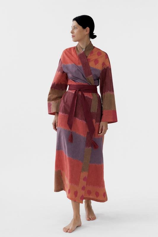 100% cotton ikat long kimono in pink, purple, orange, and brown, handloom fabric, with belt and tassel, front view, women’s loungewear